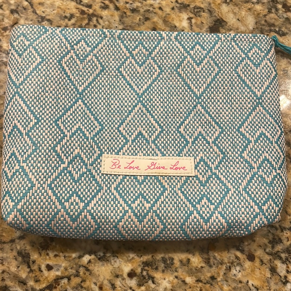 Josie Maran blue and white aztec print cosmetic bag
